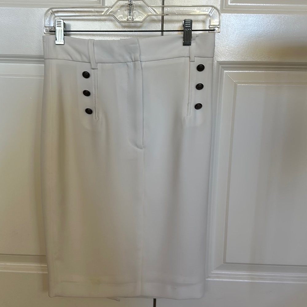 Women knee length skirt. Rayon with front side buttons. Front zip, fitted